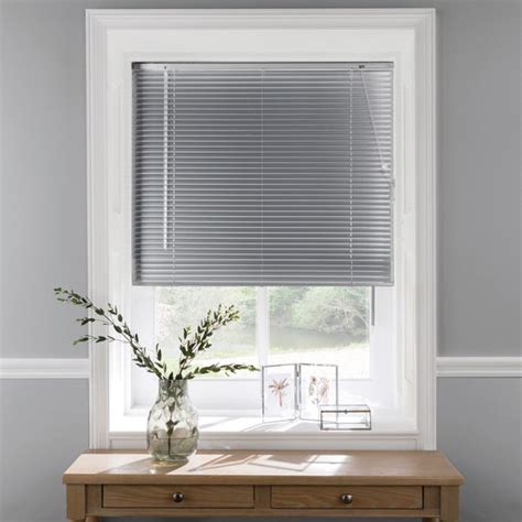 silver window blinds reflective